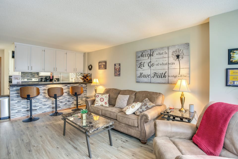 Living Room/Dining Area | Single-Story Condo | Breakfast Bar w/ Seating