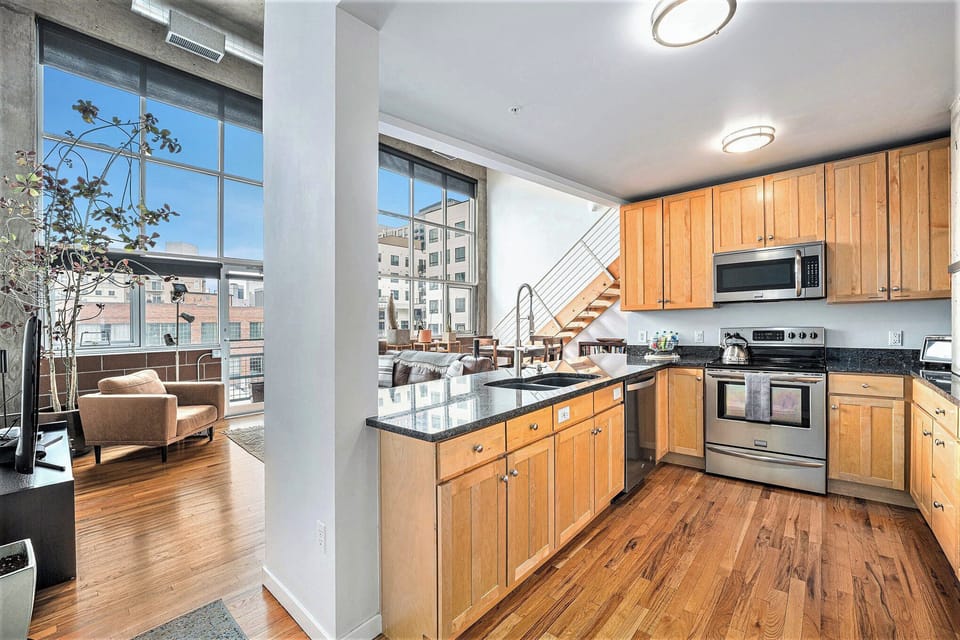 Bring out the chef in you in this spacious, open-concept kitchen with granite countertops and stainless steel appliances — perfect for creativity and connection!
