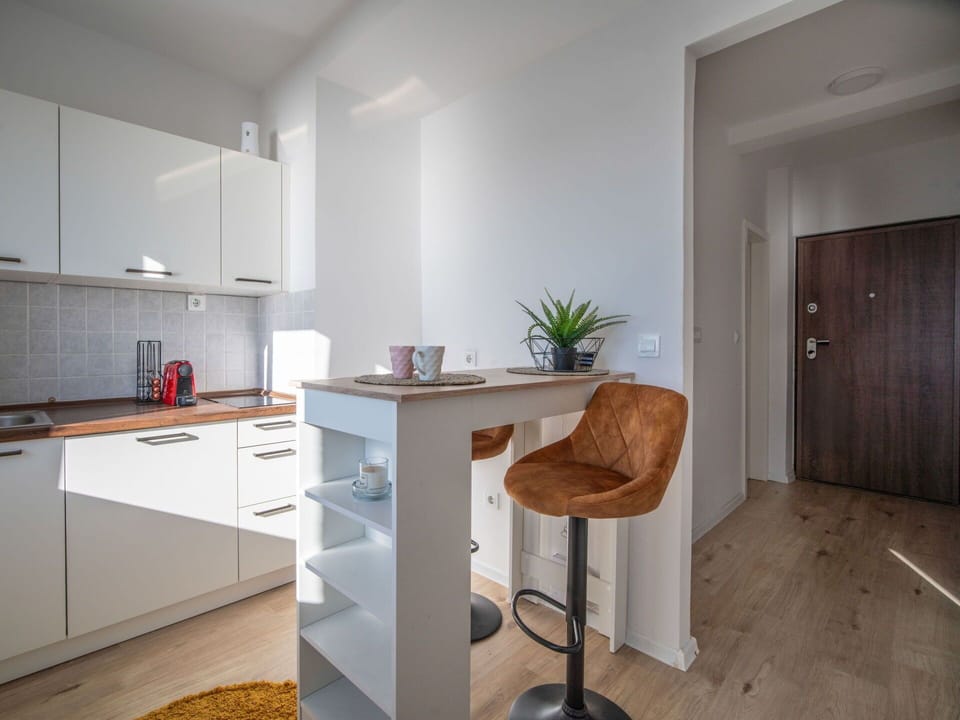 Furniture, Interior Design, Flooring, Floor, Wood, Cabinetry, Countertop, Room, Ceiling, Kitchen