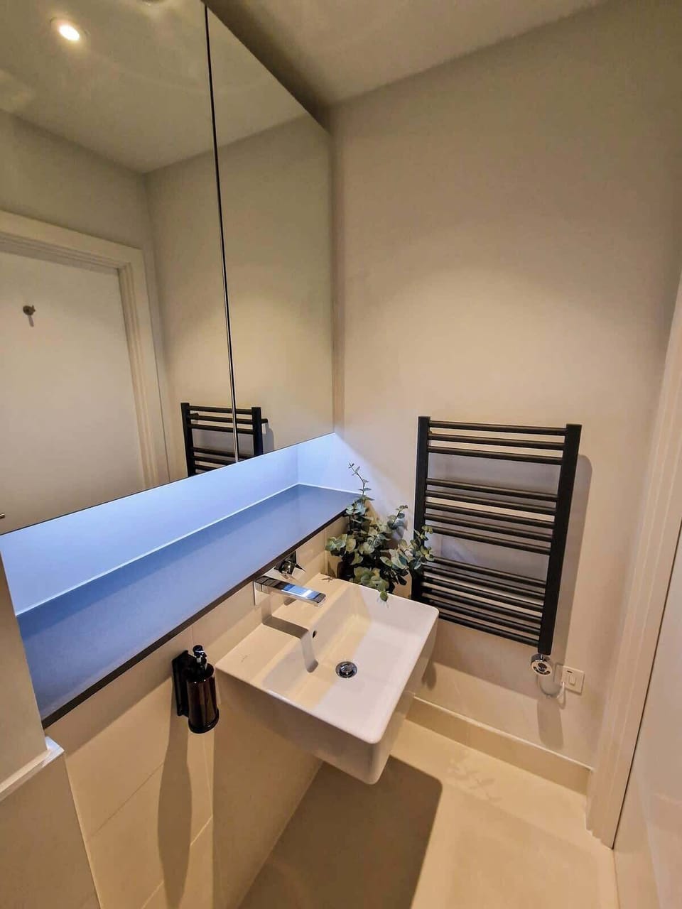 Step into a spotless, modern bathroom with everything you need for a refreshing start to the day