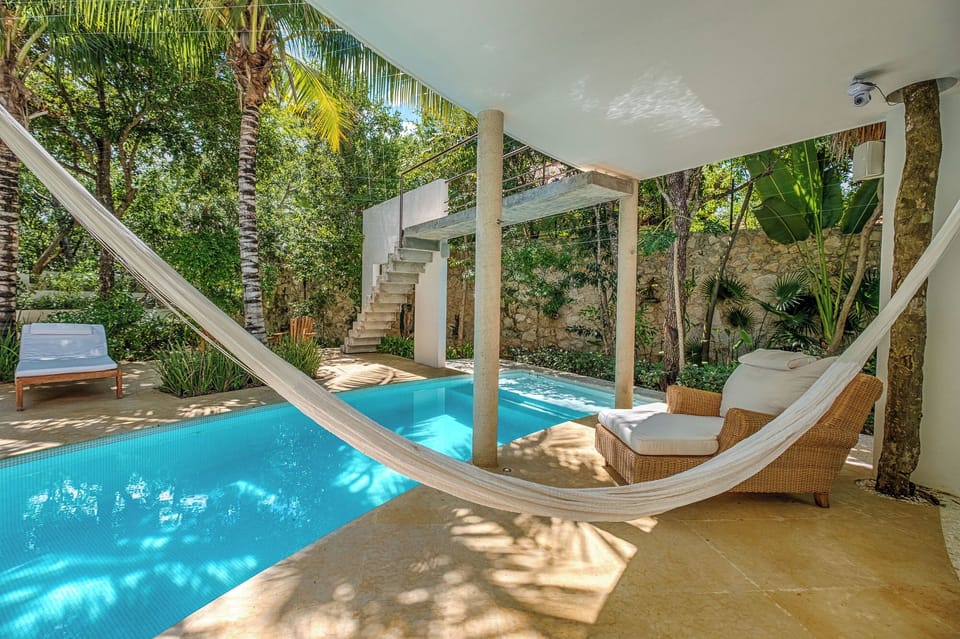Hammock and sunbeds by the pool