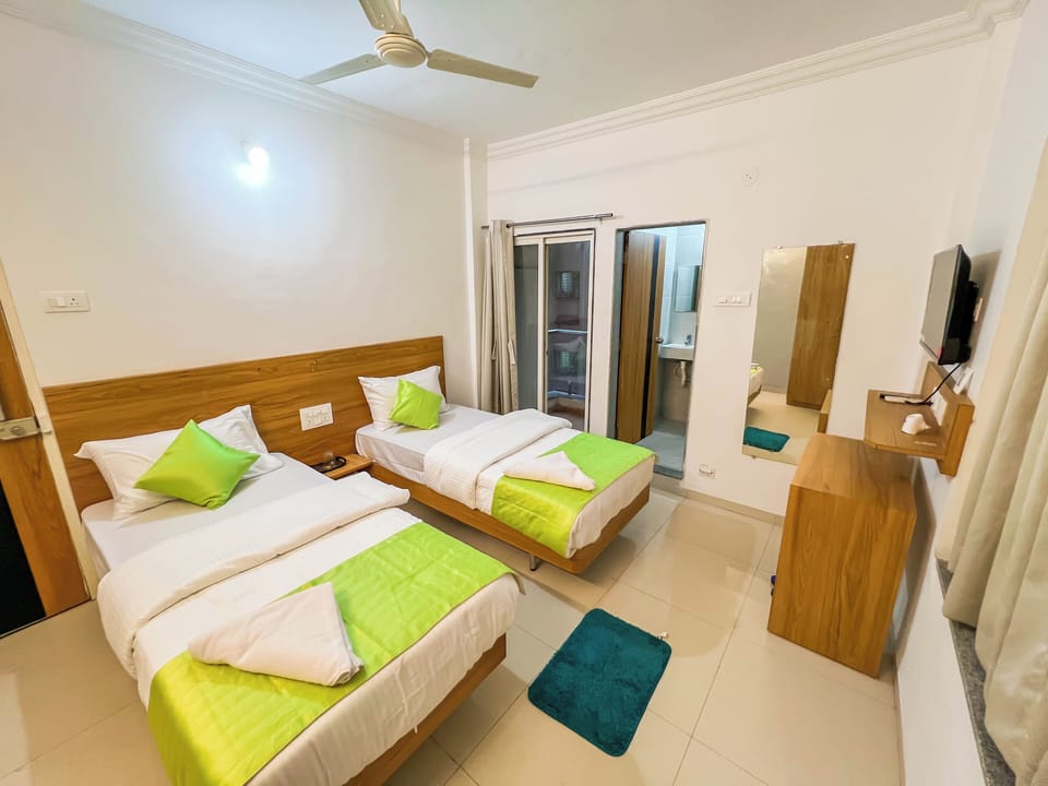 Deluxe Room, Balcony, City View | Desk, laptop workspace, free WiFi