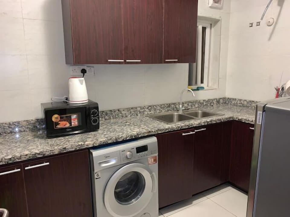 Economy Apartment, Balcony, City View | Private kitchen | Fridge, microwave, oven, stovetop