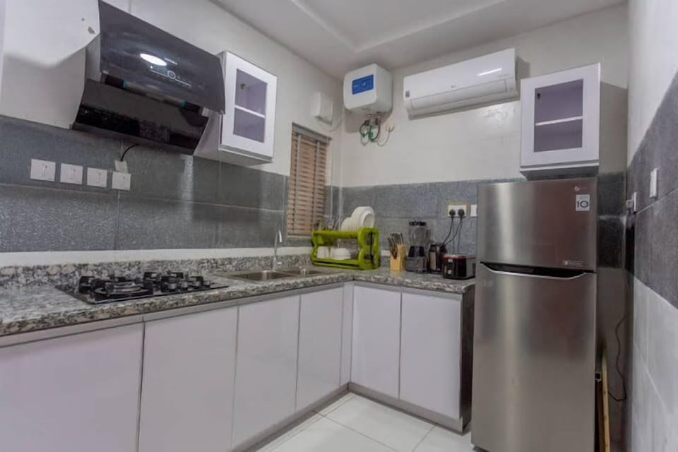 Economy Apartment, Balcony, City View | Private kitchen | Fridge, microwave, oven, stovetop
