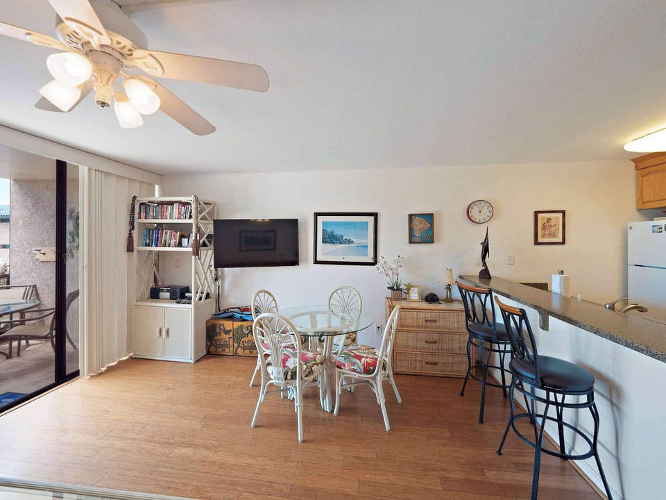 Living & dining area with queen sofa sleeper, TV, and table with seating for 4