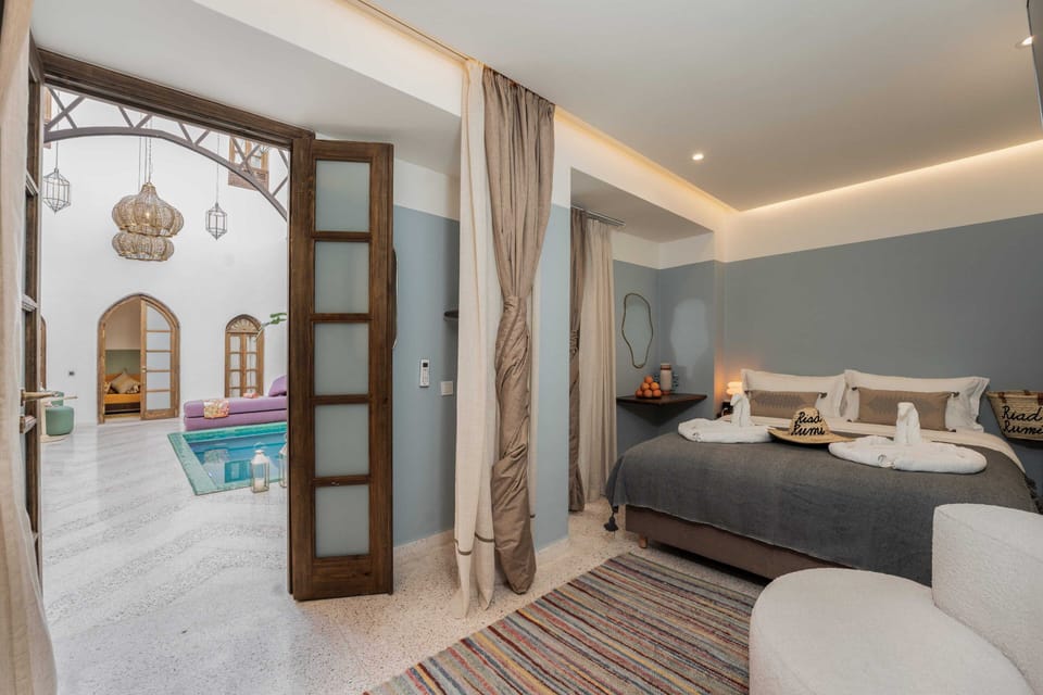 Deluxe Double Room, Pool View | In-room safe, blackout drapes, soundproofing, iron/ironing board