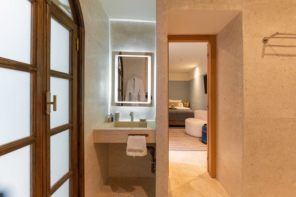 Deluxe Double Room, Pool View | Bathroom | Shower, hair dryer, bathrobes, slippers