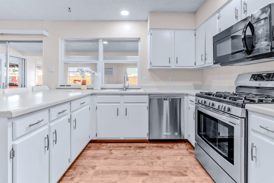 A modern kitchen with a cozy and inviting ambiance. 🏡✨