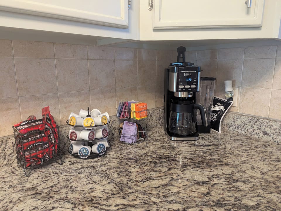 Coffee bar K-cups, brewed coffee, and Hot Tea