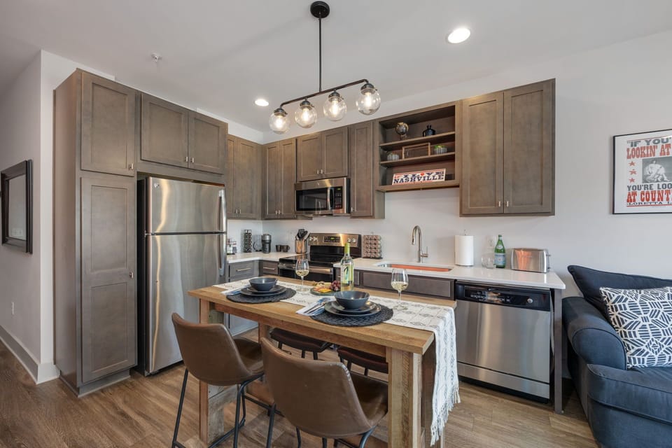 Bright open kitchen and dining space with modern appliances.