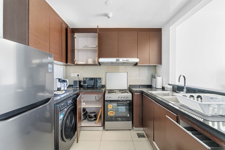 Design Apartment, 1 King Bed | Private kitchen | Full-size fridge, microwave, coffee/tea maker, electric kettle