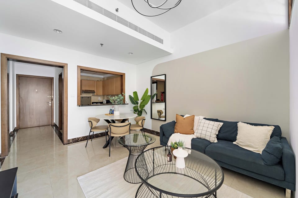 Signature Apartment, Multiple Beds | Living area | 50-inch Smart TV with digital channels