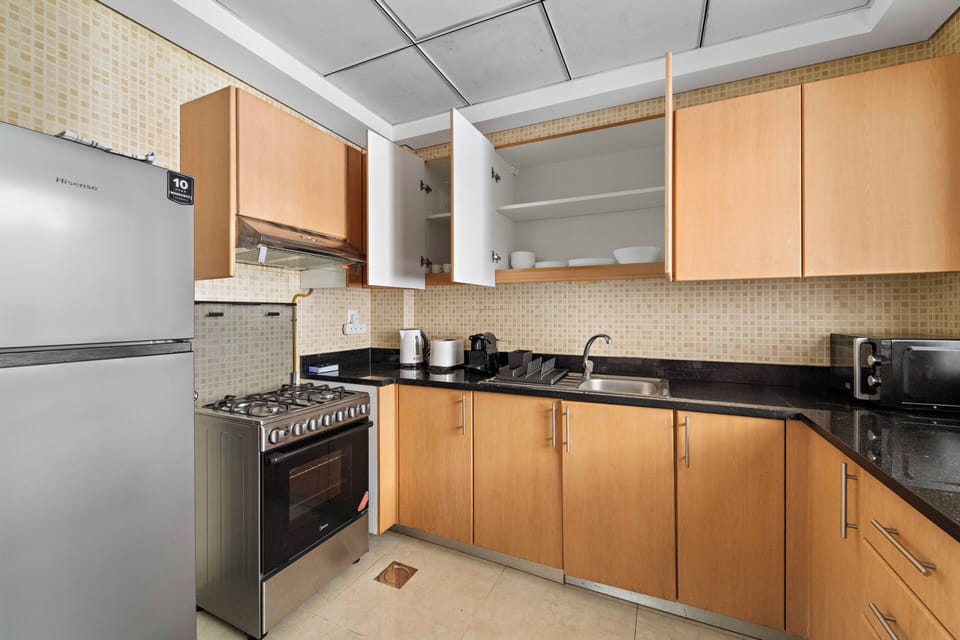 Signature Apartment, Multiple Beds | Private kitchen | Fridge, dishwasher, coffee/tea maker, electric kettle