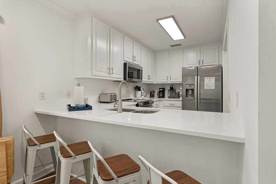 Spacious kitchen with seating at the bar