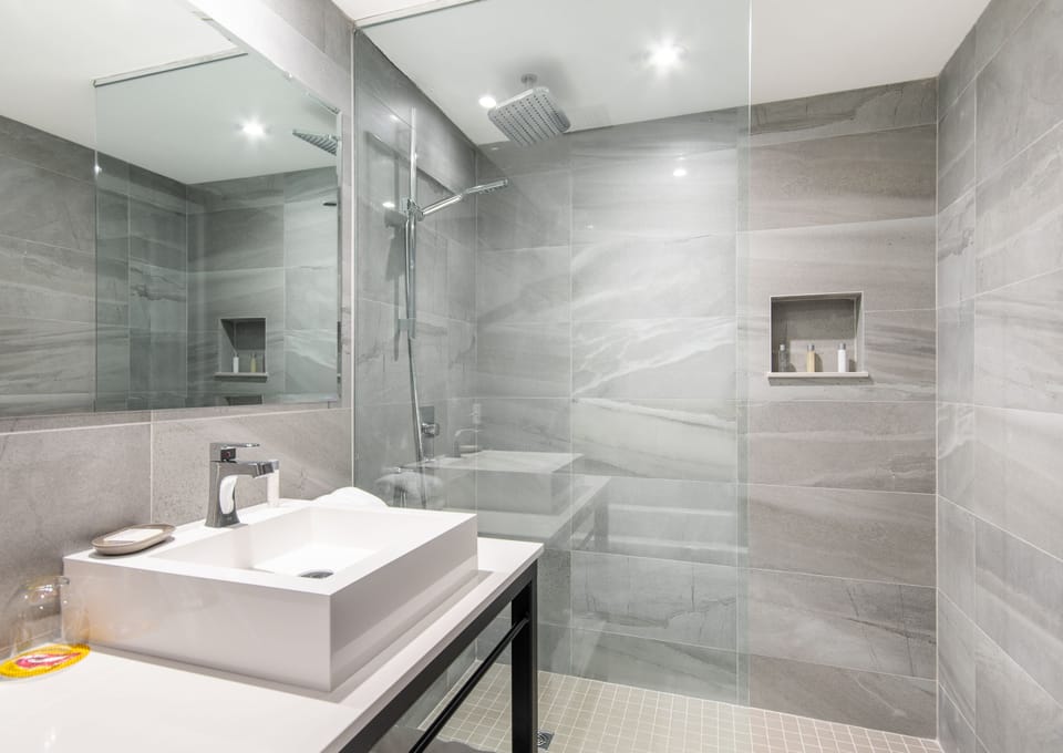 Designer toiletries, hair dryer, bathrobes, towels