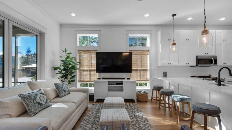 Living room: Smart TV, central heat, central A/C, main floor, screened-in porch access