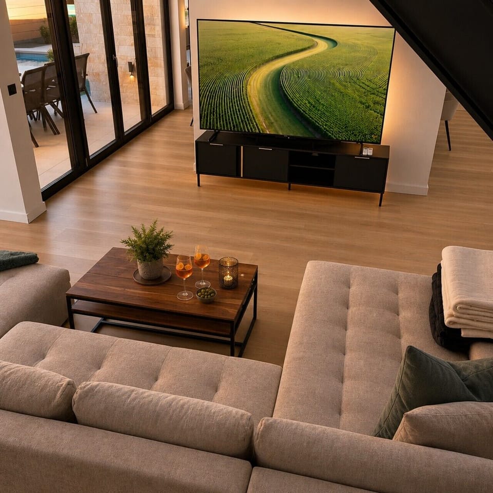 Cozy Living Lounge with Large Smart TV & Sonos speaker