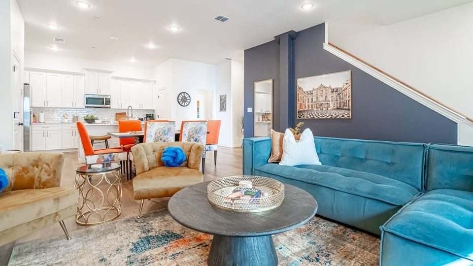 Kick back in a stylish, open-concept living space designed for comfort and connection. Whether you're debriefing after a Rangers game, watching pre-game coverage on the smart TV or just relaxing with your crew—The Ryan's living area has you covered.
