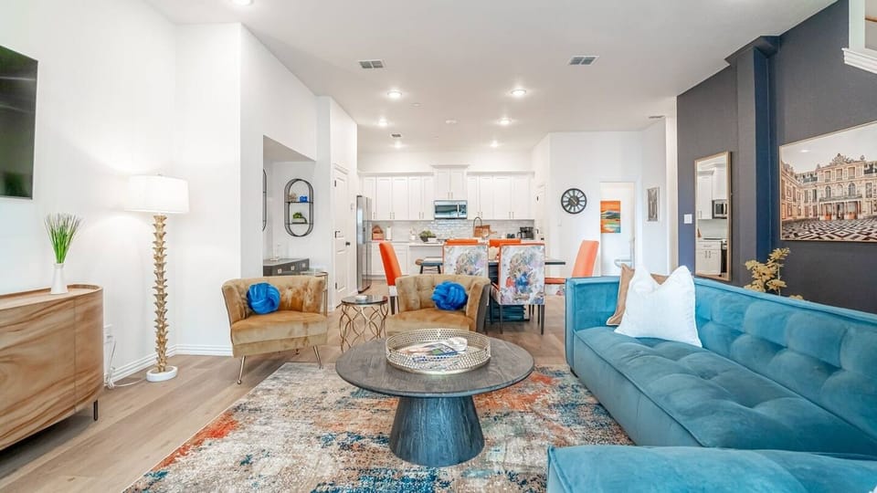 Kick back in a stylish, open-concept living space designed for comfort and connection. Whether you're debriefing after a Rangers game, watching pre-game coverage on the smart TV, or just relaxing with your crew—The Ryan's living area has you covered.
