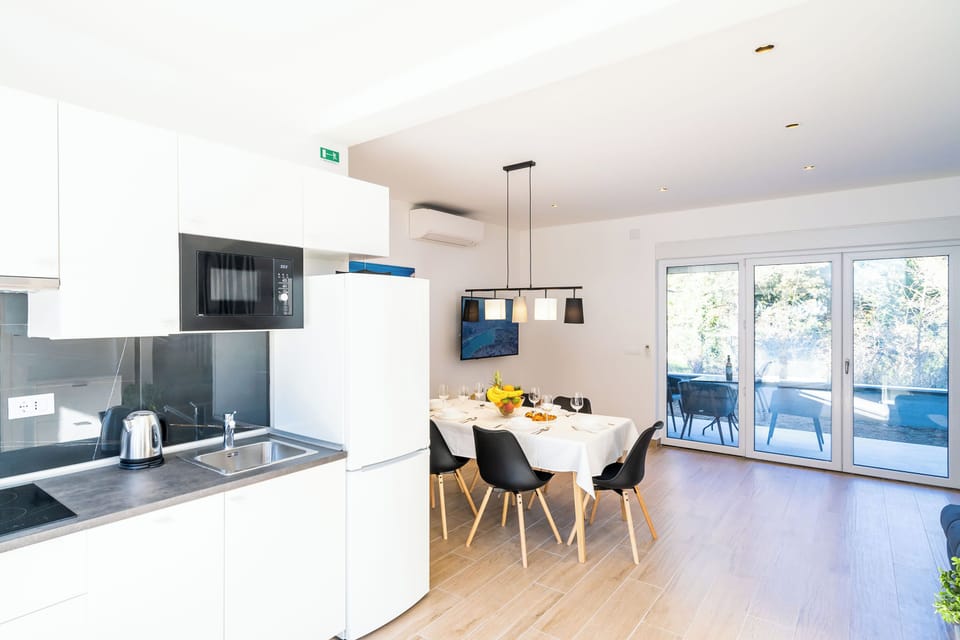 Luxury Apartment, Balcony, Garden View | Private kitchen | Full-size fridge, microwave, stovetop, dishwasher