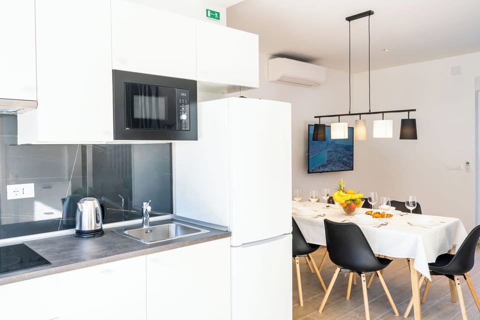Luxury Apartment, Balcony, Garden View | Private kitchen | Full-size fridge, microwave, stovetop, dishwasher