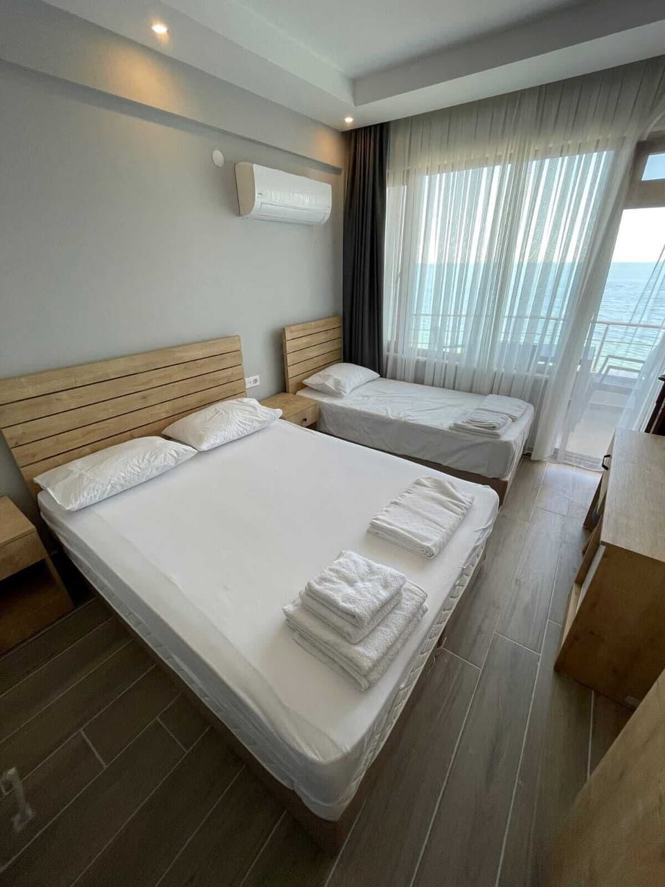 Standard Triple Room, Sea View | Minibar, soundproofing, rollaway beds, free WiFi