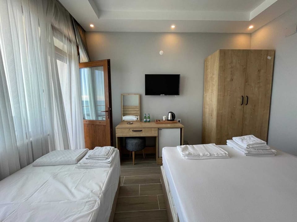 Standard Triple Room, Sea View | Minibar, soundproofing, rollaway beds, free WiFi