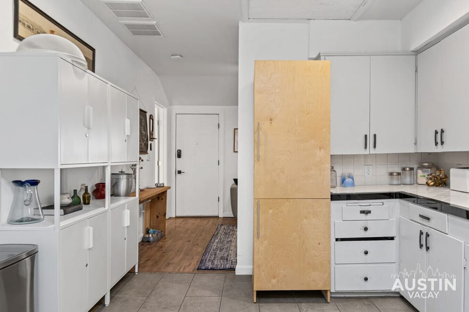 Fully equipped kitchen: fridge, stove, and microwave—ready for whipping up feasts or simple bites.