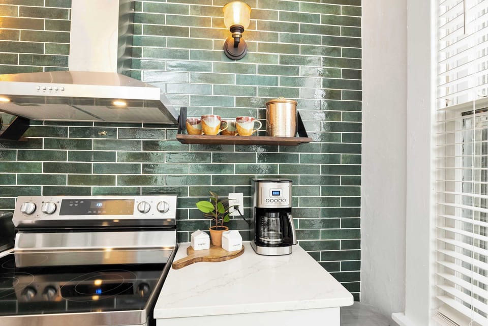 Create culinary masterpieces or enjoy exceptional take-out in the stylish kitchen
