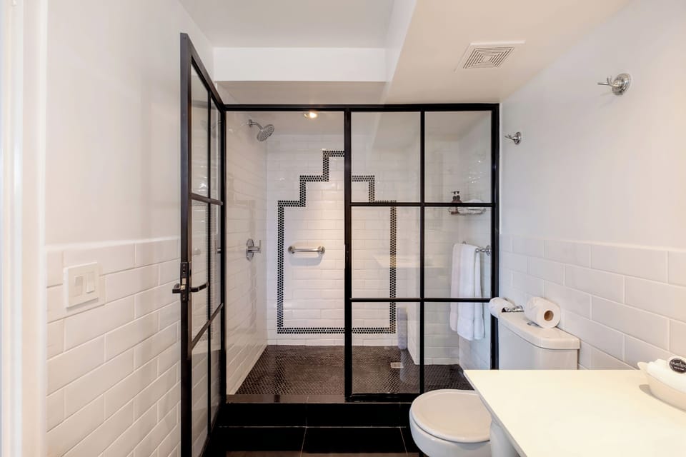 Signature Room, 1 King Bed (El Caballero Elegante) | Bathroom | Shower, designer toiletries, hair dryer, towels