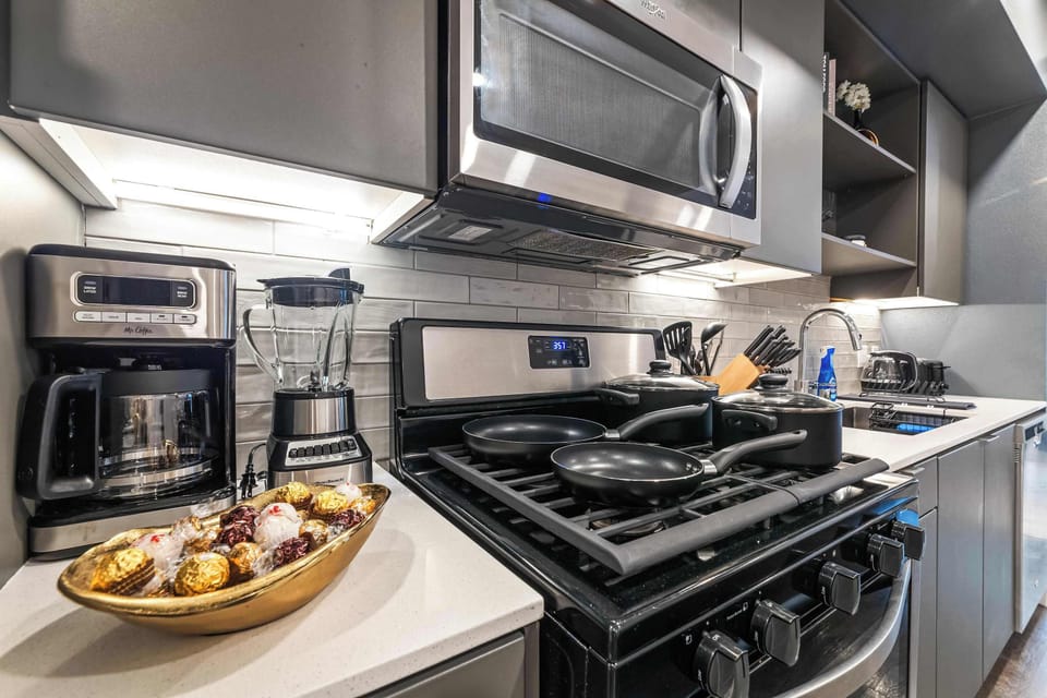 Premium stainless-steel range and coffee setup — a touch of everyday luxury designed for effortless convenience. 