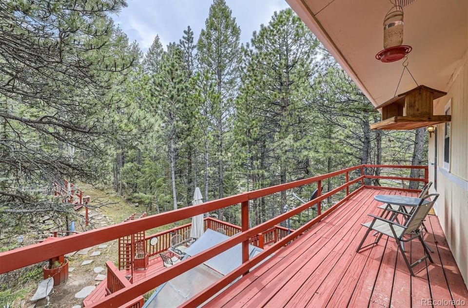Deck off primary bedroom overlooking backyard