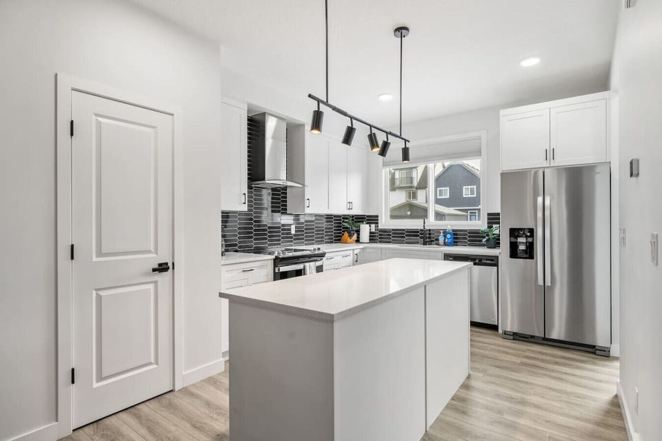 Main floor full kitchen with a drip & Keurig coffee maker, blender & rice cooker.