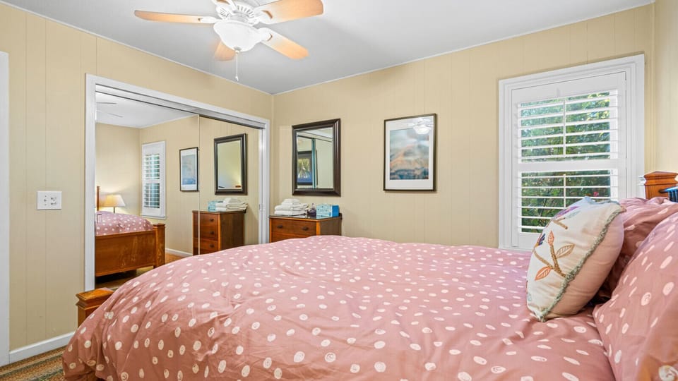 Cozy bedroom providing the most comfort with a queen bed, vast closet space and windows.