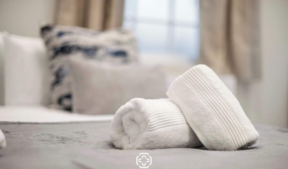 A peaceful bedroom designed for rest and relaxation, with soft bedding and a calm atmosphere that invites you to unwind after a long day.