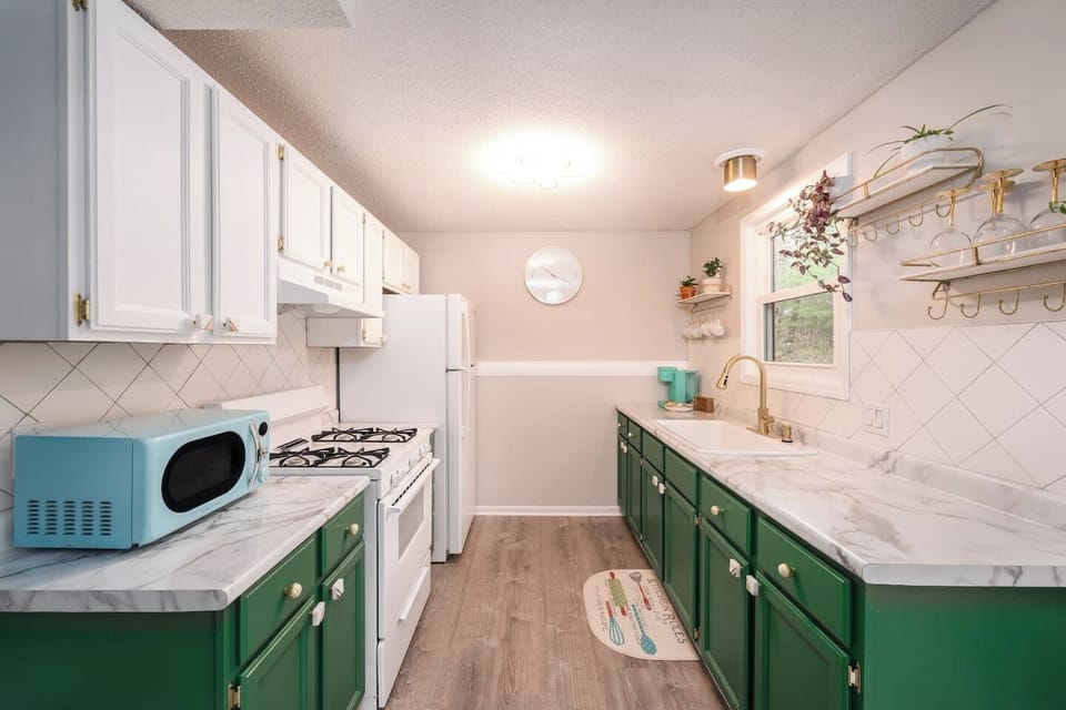 Clean and bright kitchen with all of the necessities. New ceramic pots and pans,  farm fresh eggs, local beer and chips.