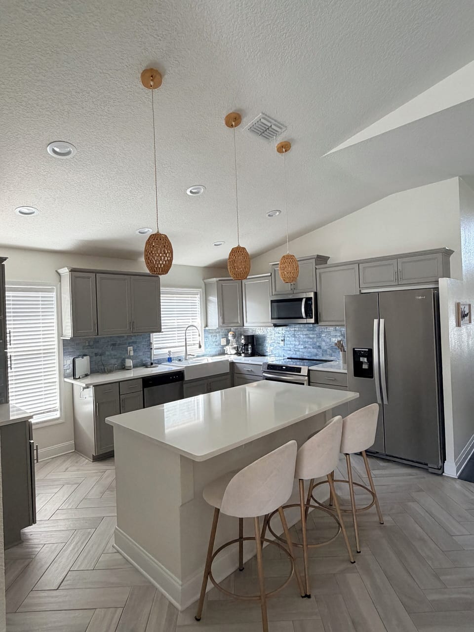 Kitchen, induction range, microwave, fridge with ice and water, dishwasher