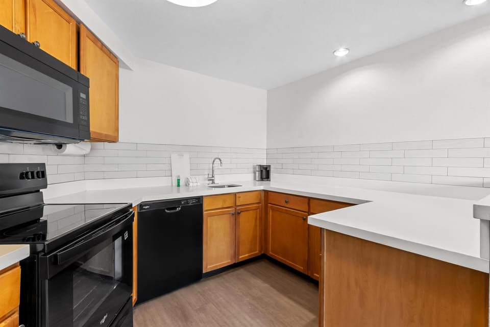 Suite, Multiple Beds | Private kitchenette | Fridge, microwave, stovetop, dishwasher