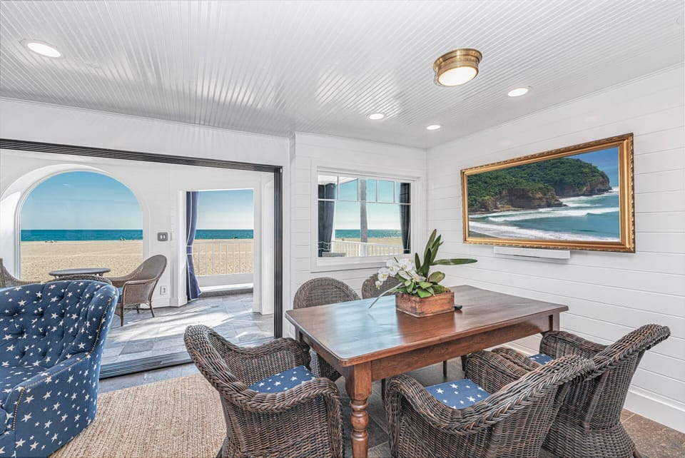 Upstairs dining area with seating for five and breathtaking large oceanview windows
                