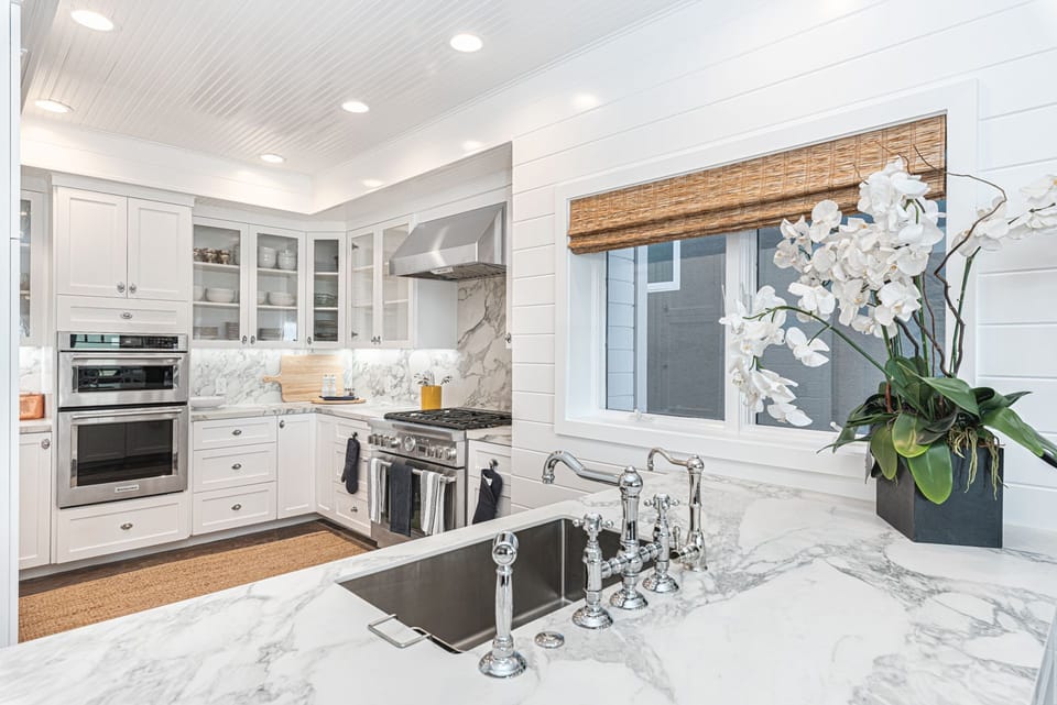 Fully remodeled second kitchen with premium Thermador appliances, marble countertops, and custom cabinetry
                