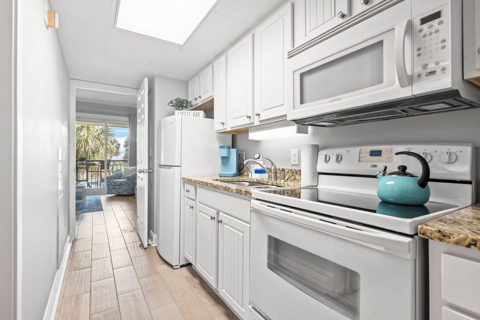 Doors on Both Ends of the Kitchen Offers More Privacy for the Bedroom
