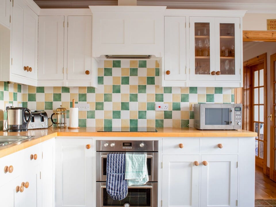 Kitchen, Countertop, Interior Design, Kitchen Appliance, Cabinetry, Flooring, Major Appliance, Drawer, Room, Cupboard