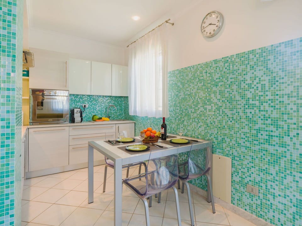 Flooring, Interior Design, Floor, Tile, Kitchen, Countertop, Chair, Mosaic, Hotel, Houseplant
