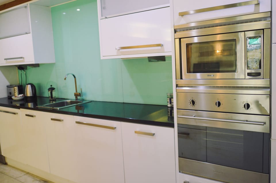 Apartment, 2 Bedrooms | Private kitchen | Full-size fridge, microwave, oven, stovetop