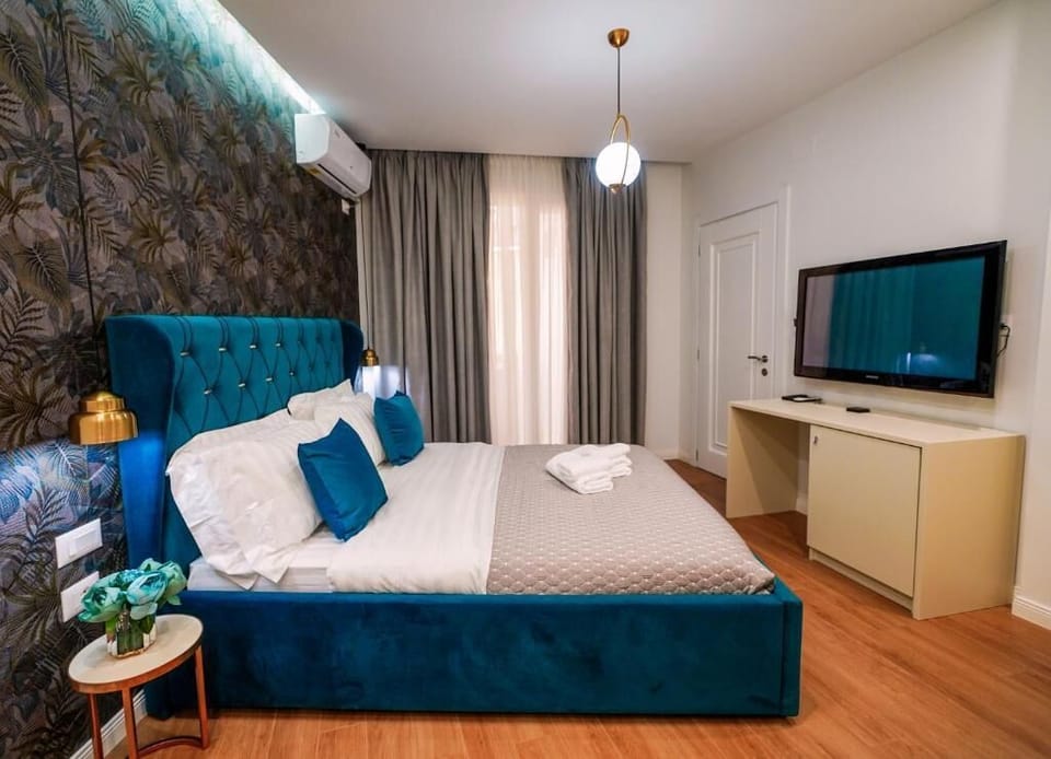 Deluxe Double Room, Balcony, City View | Desk, blackout drapes, soundproofing, iron/ironing board