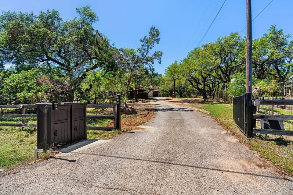 Welcoming gated entrance leading to a peaceful countryside retreat.