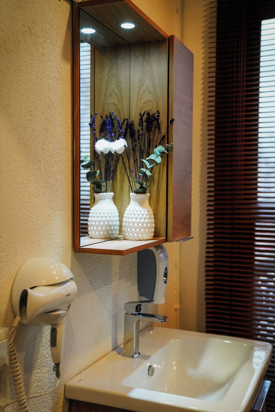 Shower, hair dryer, slippers, towels