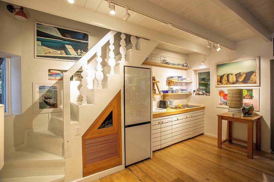 Staircase master, kitchen, sink, storage, fridge,freezer, cooktop and oven 