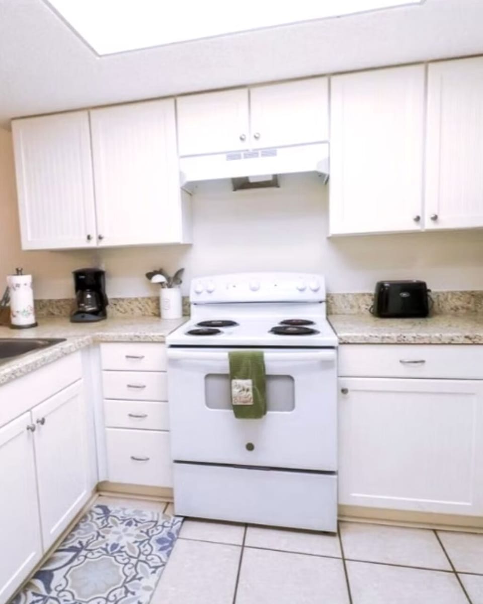 Full Kitchen with stacked washer dryer inside closet