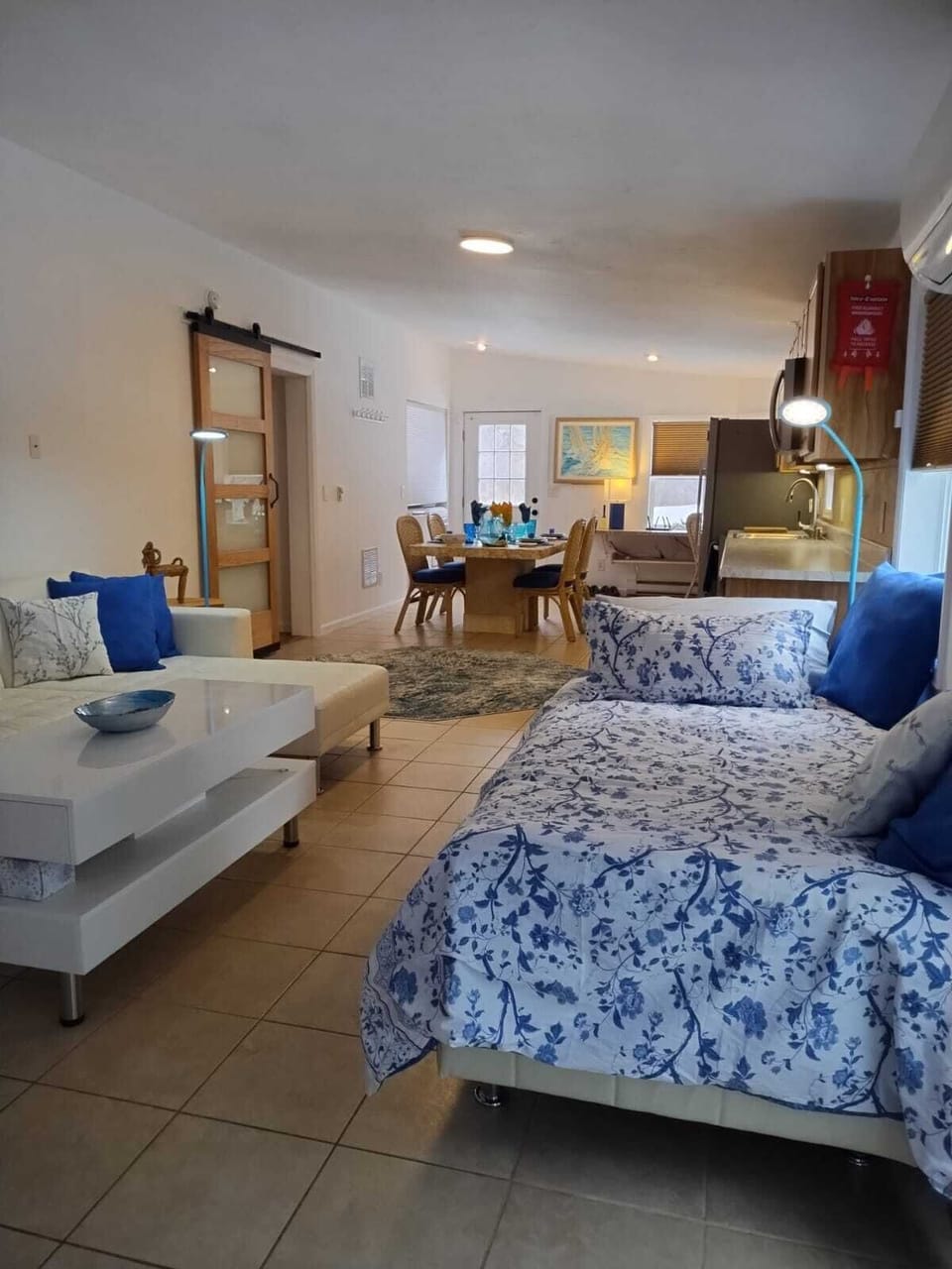 Full Size bed in living room area.